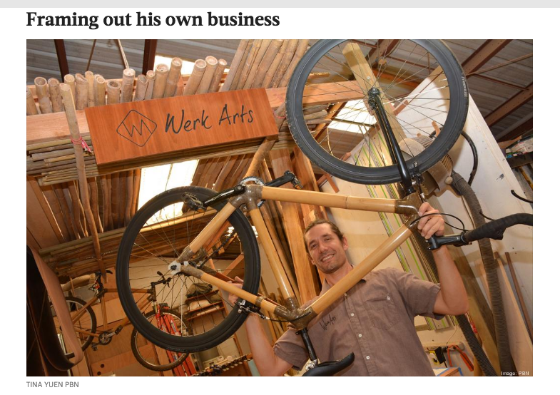 barret werk, owner of werk arts, shows his handmade bamboo bicycle frame at his shop in honolulu